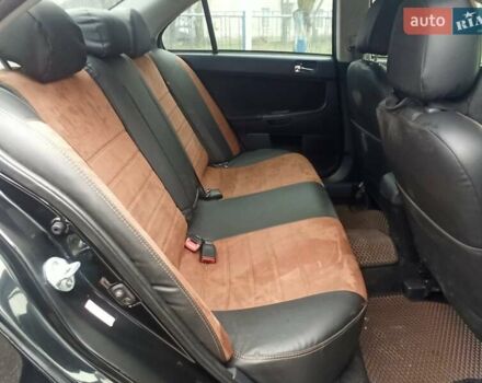 Черный Мицубиси Лансер, объемом двигателя 2 л и пробегом 195 тыс. км за 7899 $, фото 12 на Automoto.ua