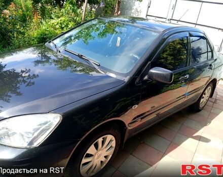 Черный Мицубиси Лансер, объемом двигателя 1.6 л и пробегом 247 тыс. км за 4000 $, фото 1 на Automoto.ua