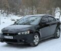 Черный Мицубиси Лансер, объемом двигателя 2 л и пробегом 180 тыс. км за 6700 $, фото 1 на Automoto.ua