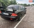 Чорний Міцубісі Lancer, об'ємом двигуна 1.6 л та пробігом 265 тис. км за 5000 $, фото 3 на Automoto.ua