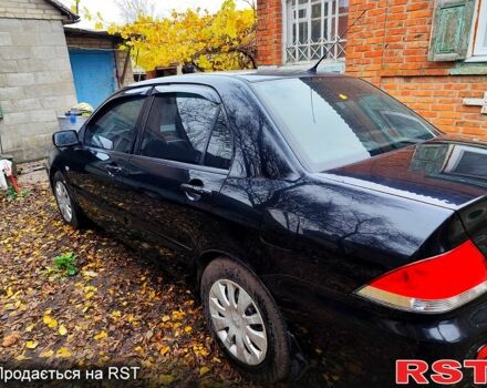 Черный Мицубиси Лансер, объемом двигателя 1.6 л и пробегом 171 тыс. км за 4350 $, фото 3 на Automoto.ua