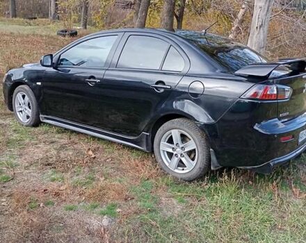 Черный Мицубиси Лансер, объемом двигателя 2 л и пробегом 200 тыс. км за 5900 $, фото 2 на Automoto.ua