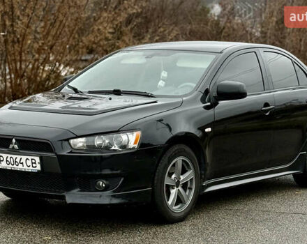 Черный Мицубиси Лансер, объемом двигателя 2 л и пробегом 215 тыс. км за 5500 $, фото 1 на Automoto.ua