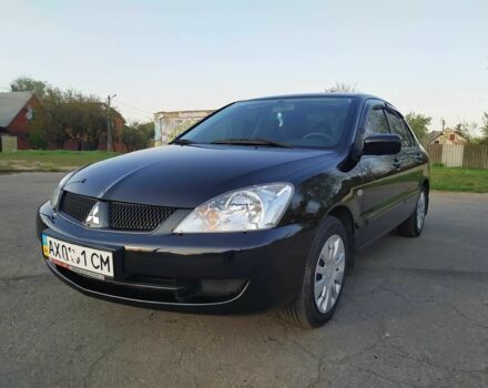Черный Мицубиси Лансер, объемом двигателя 1.6 л и пробегом 32 тыс. км за 9000 $, фото 9 на Automoto.ua