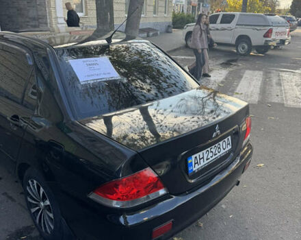 Чорний Міцубісі Lancer, об'ємом двигуна 1.58 л та пробігом 243 тис. км за 3800 $, фото 1 на Automoto.ua
