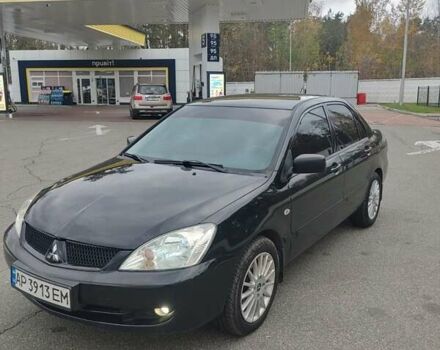 Чорний Міцубісі Lancer, об'ємом двигуна 1.58 л та пробігом 190 тис. км за 3750 $, фото 1 на Automoto.ua