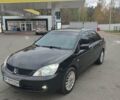 Чорний Міцубісі Lancer, об'ємом двигуна 1.58 л та пробігом 190 тис. км за 3750 $, фото 1 на Automoto.ua