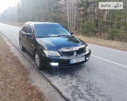 Чорний Міцубісі Lancer, об'ємом двигуна 1.58 л та пробігом 210 тис. км за 4200 $, фото 1 на Automoto.ua