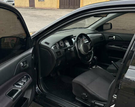 Черный Мицубиси Лансер, объемом двигателя 2 л и пробегом 143 тыс. км за 4999 $, фото 7 на Automoto.ua