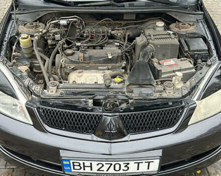 Чорний Міцубісі Lancer, об'ємом двигуна 1.59 л та пробігом 300 тис. км за 3400 $, фото 3 на Automoto.ua