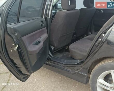 Черный Мицубиси Лансер, объемом двигателя 2 л и пробегом 286 тыс. км за 4000 $, фото 12 на Automoto.ua