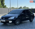 Чорний Міцубісі Lancer, об'ємом двигуна 1.58 л та пробігом 191 тис. км за 4899 $, фото 1 на Automoto.ua