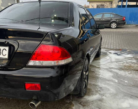 Черный Мицубиси Лансер, объемом двигателя 1.6 л и пробегом 180 тыс. км за 3499 $, фото 11 на Automoto.ua