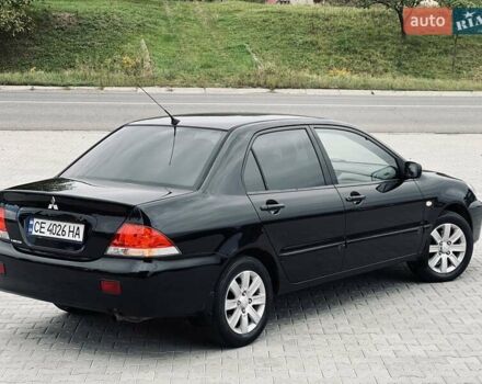 Чорний Міцубісі Lancer, об'ємом двигуна 1.6 л та пробігом 243 тис. км за 4950 $, фото 22 на Automoto.ua