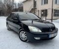 Черный Мицубиси Лансер, объемом двигателя 1.6 л и пробегом 234 тыс. км за 5000 $, фото 1 на Automoto.ua