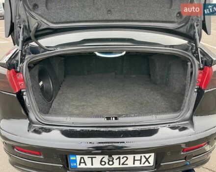 Черный Мицубиси Лансер, объемом двигателя 2 л и пробегом 246 тыс. км за 7500 $, фото 21 на Automoto.ua