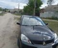 Черный Мицубиси Лансер, объемом двигателя 1.6 л и пробегом 250 тыс. км за 3291 $, фото 2 на Automoto.ua