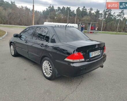 Чорний Міцубісі Lancer, об'ємом двигуна 1.58 л та пробігом 190 тис. км за 3750 $, фото 4 на Automoto.ua