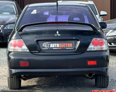 Черный Мицубиси Лансер, объемом двигателя 1.6 л и пробегом 260 тыс. км за 3700 $, фото 2 на Automoto.ua