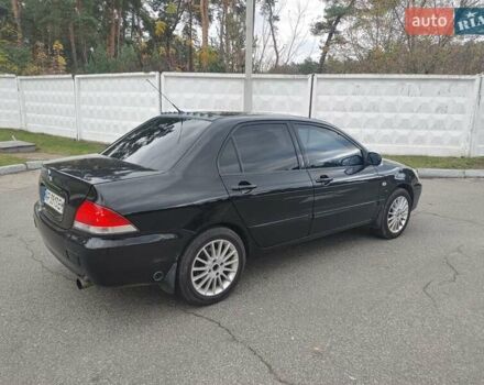 Чорний Міцубісі Lancer, об'ємом двигуна 1.58 л та пробігом 190 тис. км за 3750 $, фото 7 на Automoto.ua