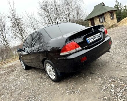 Чорний Міцубісі Lancer, об'ємом двигуна 1.6 л та пробігом 216 тис. км за 4990 $, фото 2 на Automoto.ua