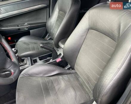 Черный Мицубиси Лансер, объемом двигателя 2 л и пробегом 246 тыс. км за 7500 $, фото 16 на Automoto.ua