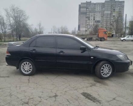 Черный Мицубиси Лансер, объемом двигателя 1.6 л и пробегом 310 тыс. км за 5700 $, фото 3 на Automoto.ua