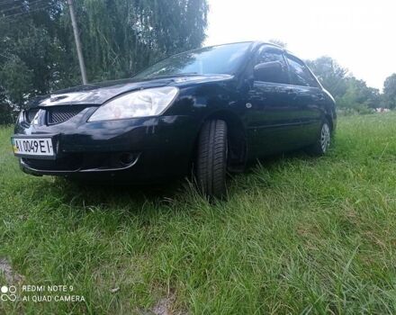 Чорний Міцубісі Lancer, об'ємом двигуна 1.58 л та пробігом 400 тис. км за 3700 $, фото 4 на Automoto.ua