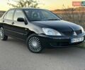 Черный Мицубиси Лансер, объемом двигателя 1.58 л и пробегом 139 тыс. км за 5200 $, фото 10 на Automoto.ua