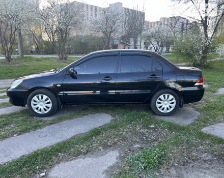 Чорний Міцубісі Lancer, об'ємом двигуна 1.58 л та пробігом 161 тис. км за 5300 $, фото 7 на Automoto.ua