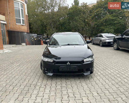 Черный Мицубиси Лансер, объемом двигателя 2 л и пробегом 200 тыс. км за 6199 $, фото 1 на Automoto.ua