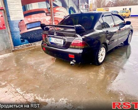 Чорний Міцубісі Lancer, об'ємом двигуна 1.6 л та пробігом 300 тис. км за 4500 $, фото 1 на Automoto.ua