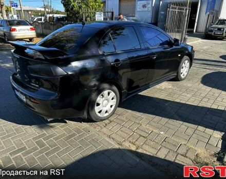 Черный Мицубиси Лансер, объемом двигателя 2 л и пробегом 250 тыс. км за 5900 $, фото 2 на Automoto.ua