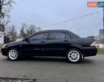 Чорний Міцубісі Lancer, об'ємом двигуна 1.6 л та пробігом 303 тис. км за 4350 $, фото 18 на Automoto.ua
