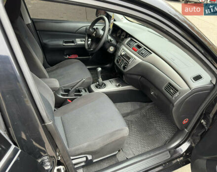 Чорний Міцубісі Lancer, об'ємом двигуна 1.58 л та пробігом 173 тис. км за 4700 $, фото 18 на Automoto.ua