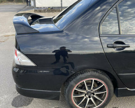 Чорний Міцубісі Lancer, об'ємом двигуна 2 л та пробігом 280 тис. км за 4600 $, фото 21 на Automoto.ua