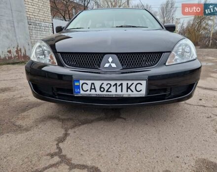 Чорний Міцубісі Lancer, об'ємом двигуна 1.6 л та пробігом 273 тис. км за 3999 $, фото 12 на Automoto.ua