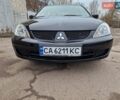 Чорний Міцубісі Lancer, об'ємом двигуна 1.6 л та пробігом 273 тис. км за 3999 $, фото 12 на Automoto.ua