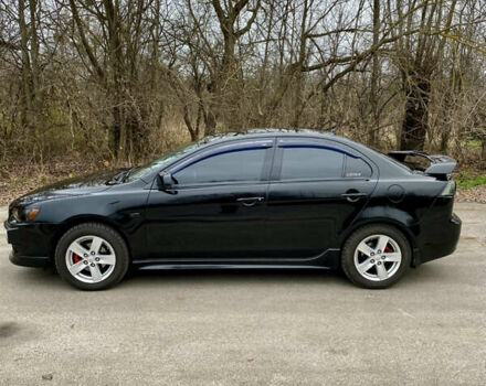 Черный Мицубиси Лансер, объемом двигателя 2 л и пробегом 164 тыс. км за 8300 $, фото 12 на Automoto.ua