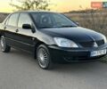 Черный Мицубиси Лансер, объемом двигателя 1.58 л и пробегом 139 тыс. км за 5200 $, фото 11 на Automoto.ua