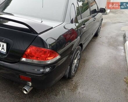 Черный Мицубиси Лансер, объемом двигателя 1.58 л и пробегом 180 тыс. км за 4500 $, фото 7 на Automoto.ua