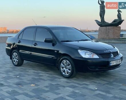 Чорний Міцубісі Lancer, об'ємом двигуна 1.58 л та пробігом 237 тис. км за 4300 $, фото 7 на Automoto.ua
