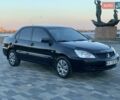 Чорний Міцубісі Lancer, об'ємом двигуна 1.58 л та пробігом 237 тис. км за 4300 $, фото 7 на Automoto.ua