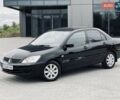 Черный Мицубиси Лансер, объемом двигателя 1.58 л и пробегом 243 тыс. км за 4950 $, фото 4 на Automoto.ua