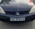 Черный Мицубиси Лансер, объемом двигателя 1.58 л и пробегом 260 тыс. км за 4100 $, фото 1 на Automoto.ua