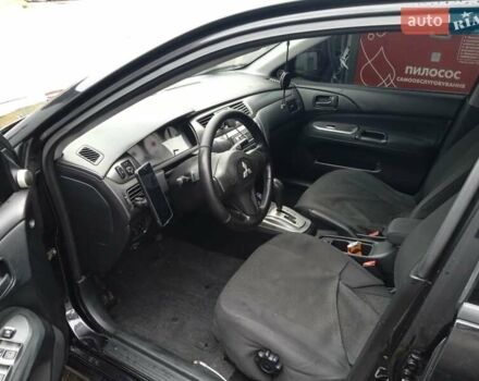 Черный Мицубиси Лансер, объемом двигателя 1.58 л и пробегом 180 тыс. км за 4500 $, фото 6 на Automoto.ua