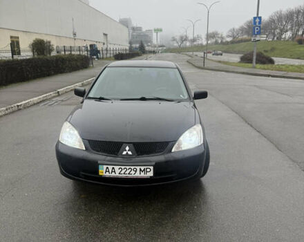 Чорний Міцубісі Lancer, об'ємом двигуна 1.58 л та пробігом 256 тис. км за 3700 $, фото 1 на Automoto.ua