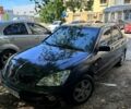 Черный Мицубиси Лансер, объемом двигателя 1.6 л и пробегом 200 тыс. км за 2500 $, фото 1 на Automoto.ua
