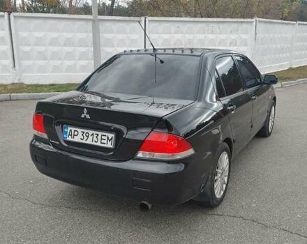 Чорний Міцубісі Lancer, об'ємом двигуна 1.58 л та пробігом 190 тис. км за 3750 $, фото 6 на Automoto.ua