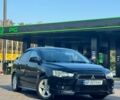 Черный Мицубиси Лансер, объемом двигателя 2 л и пробегом 210 тыс. км за 5300 $, фото 1 на Automoto.ua